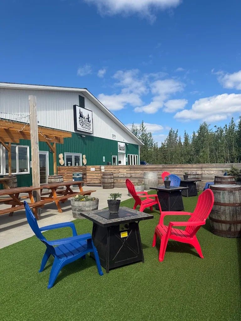 Black Spruce Brewing Company building and patio with Adirondack chairs