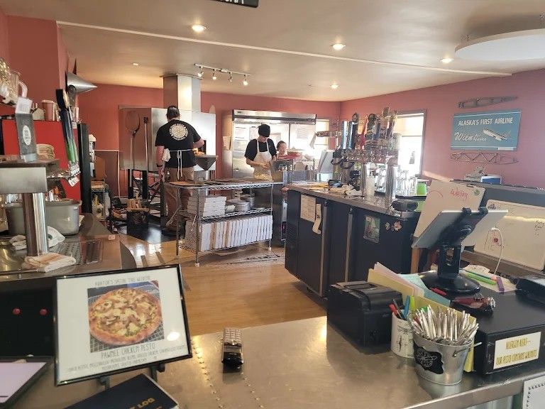 East Ramp Pizza counter with Pawnee Chicken Pesto special and kitchen staff